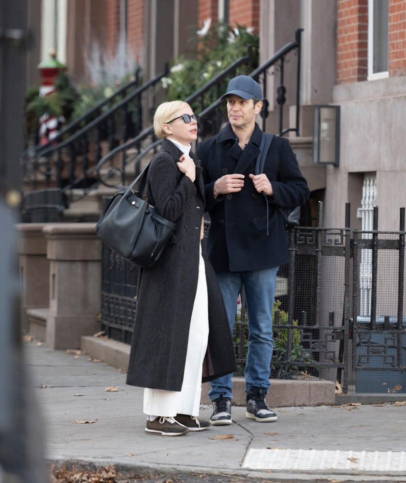 NEW YORK, NEW YORK - DECEMBER 18: Michelle Williams and Thomas Kail are seen in Brooklyn on December...