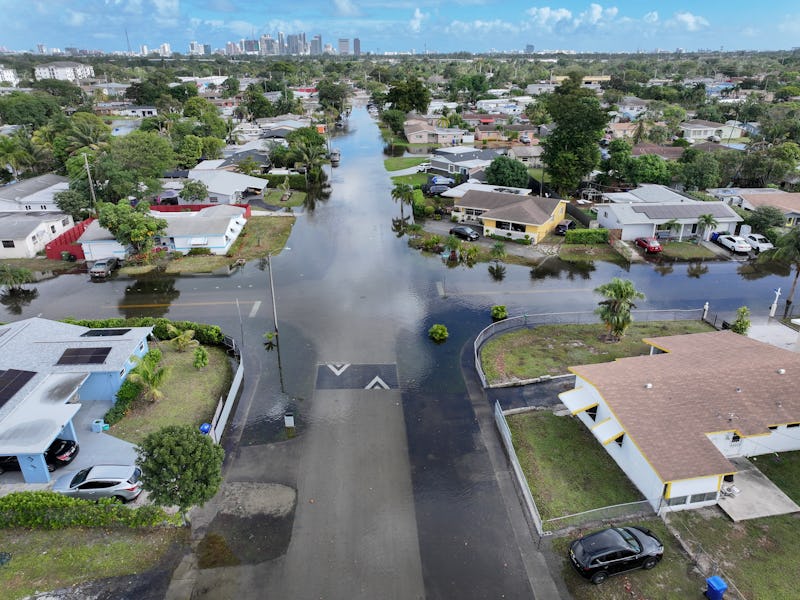 FORT LAUDERDALE, FLORIDA - DECEMBER 18: An aerial view of a flooded residential neighborhood street ...