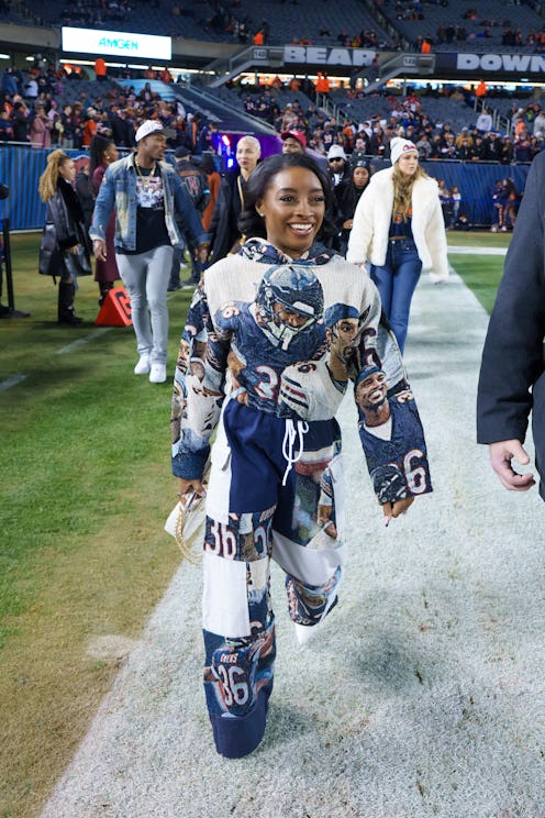CHICAGO, ILLINOIS - DECEMBER 26: Simone Biles is seen on the sideline prior to an NFL football game ...