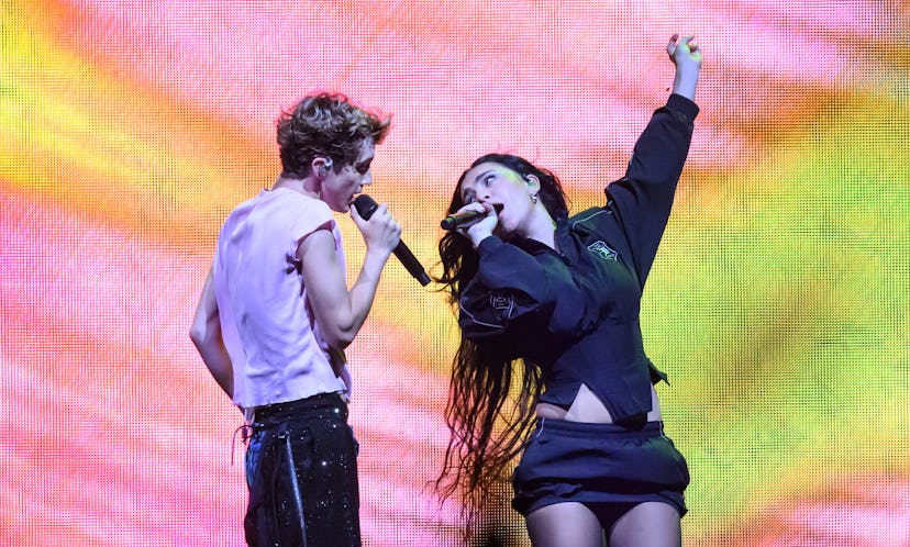 LONDON, ENGLAND - JUNE 27: Charli XCX joins Troye Sivan on stage during the Something to Give Each O…