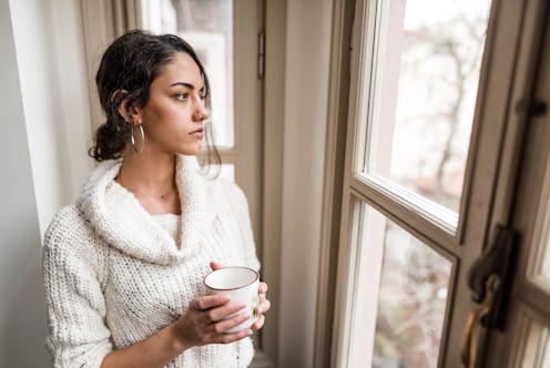 sad woman at the window