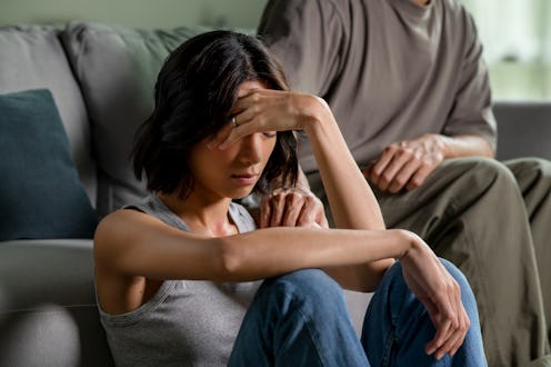 Male and female couple going through hard times in relationship problem, showing each other consolin...