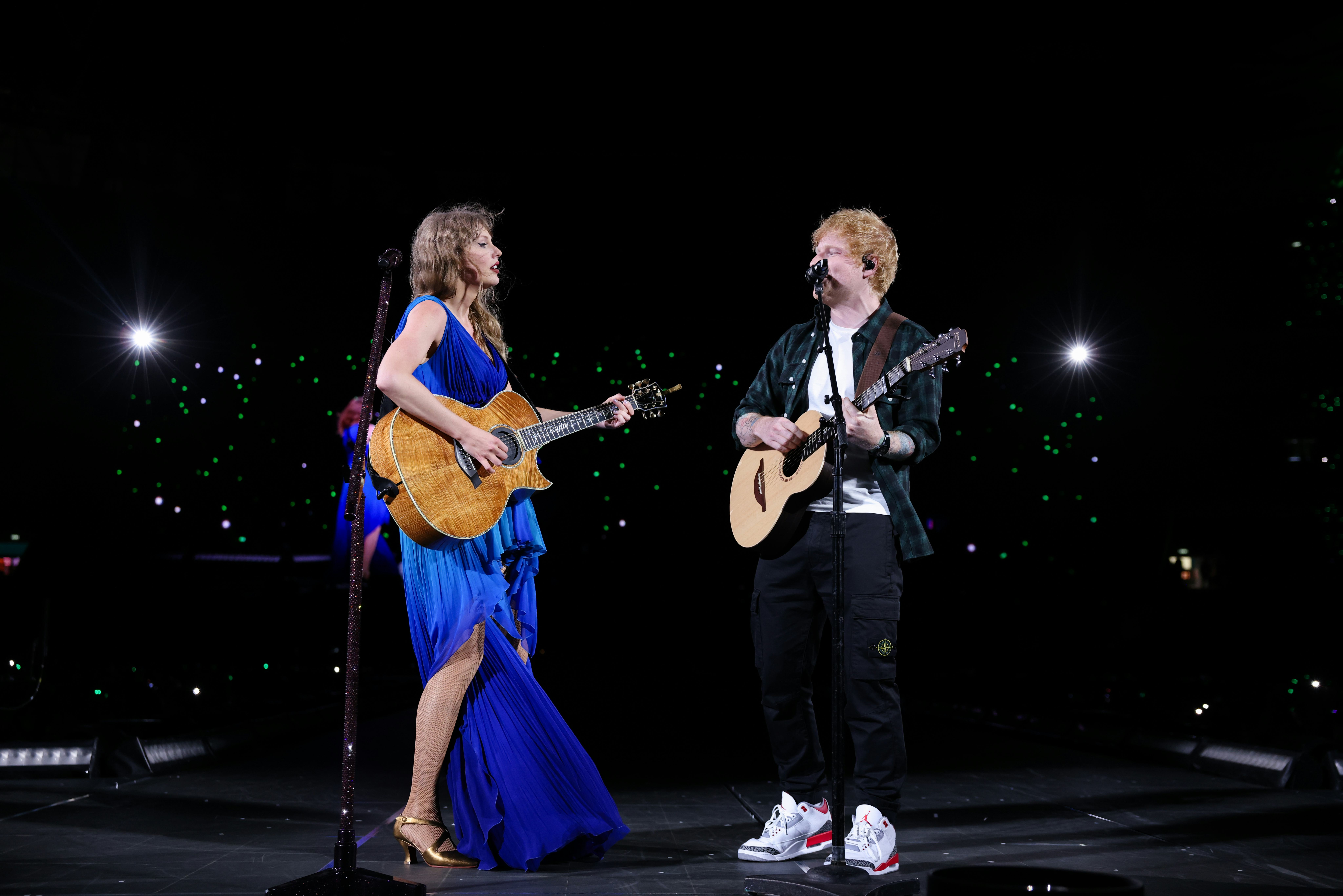 Taylor Swift and Ed Sheeran perform onstage during The Eras Tour