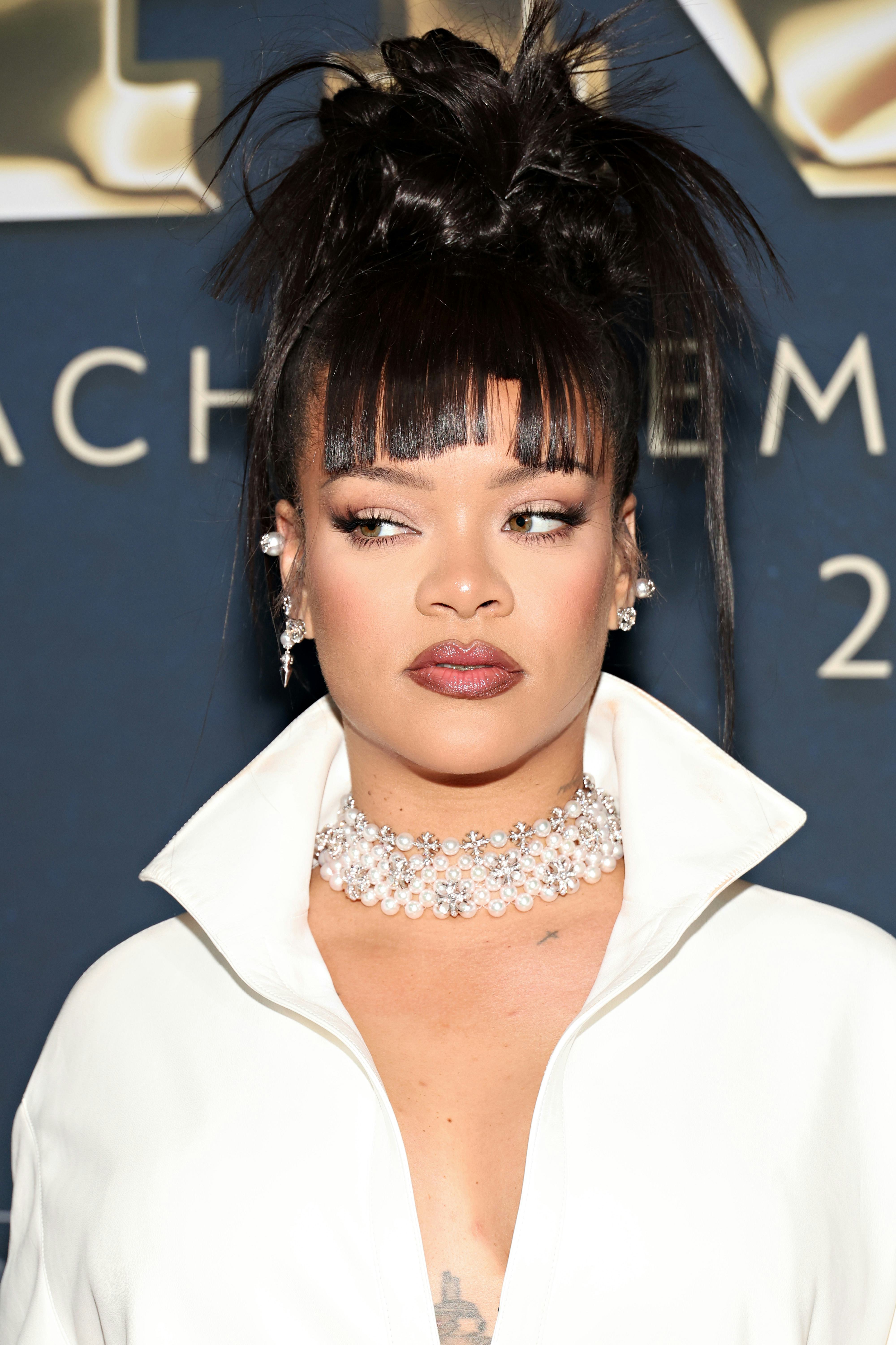 Rihanna wore a plunging Alaïa dress at the Footwear News Achievement Awards.