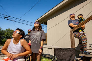KERRVILLE, TEXAS - OCTOBER 14: The Flores family watches the annular solar eclipse together on Octob...