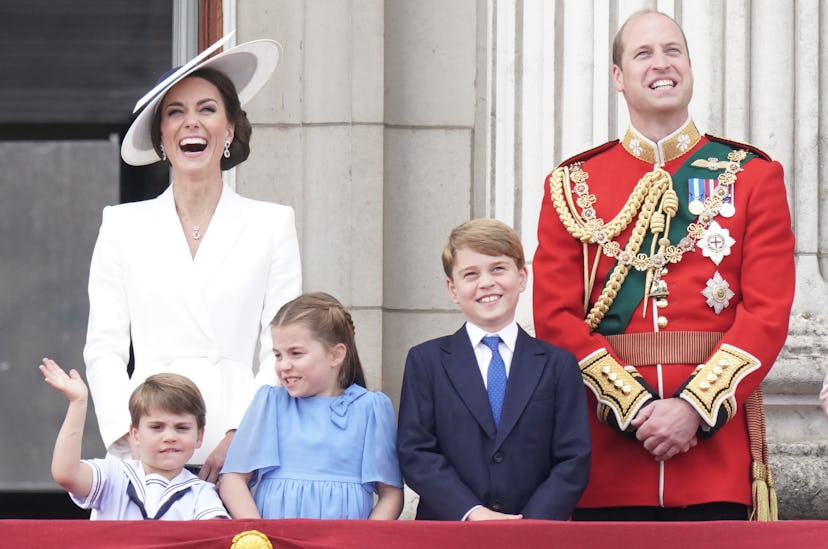 Princess Charlotte keeps an eye on her brother.