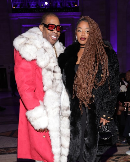 NEW YORK, NEW YORK - FEBRUARY 12: (L-R) Busta Rhymes and Cacie Smith attend the Laquan Smith fashion...