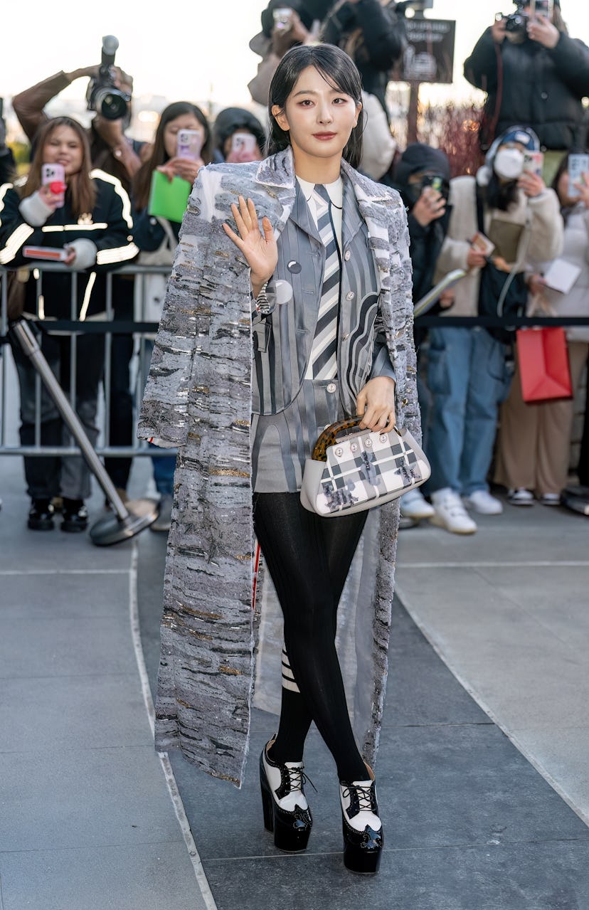 NEW YORK, NEW YORK - FEBRUARY 14: Seulgi is seen arriving to the Thom Browne fashion show during New...