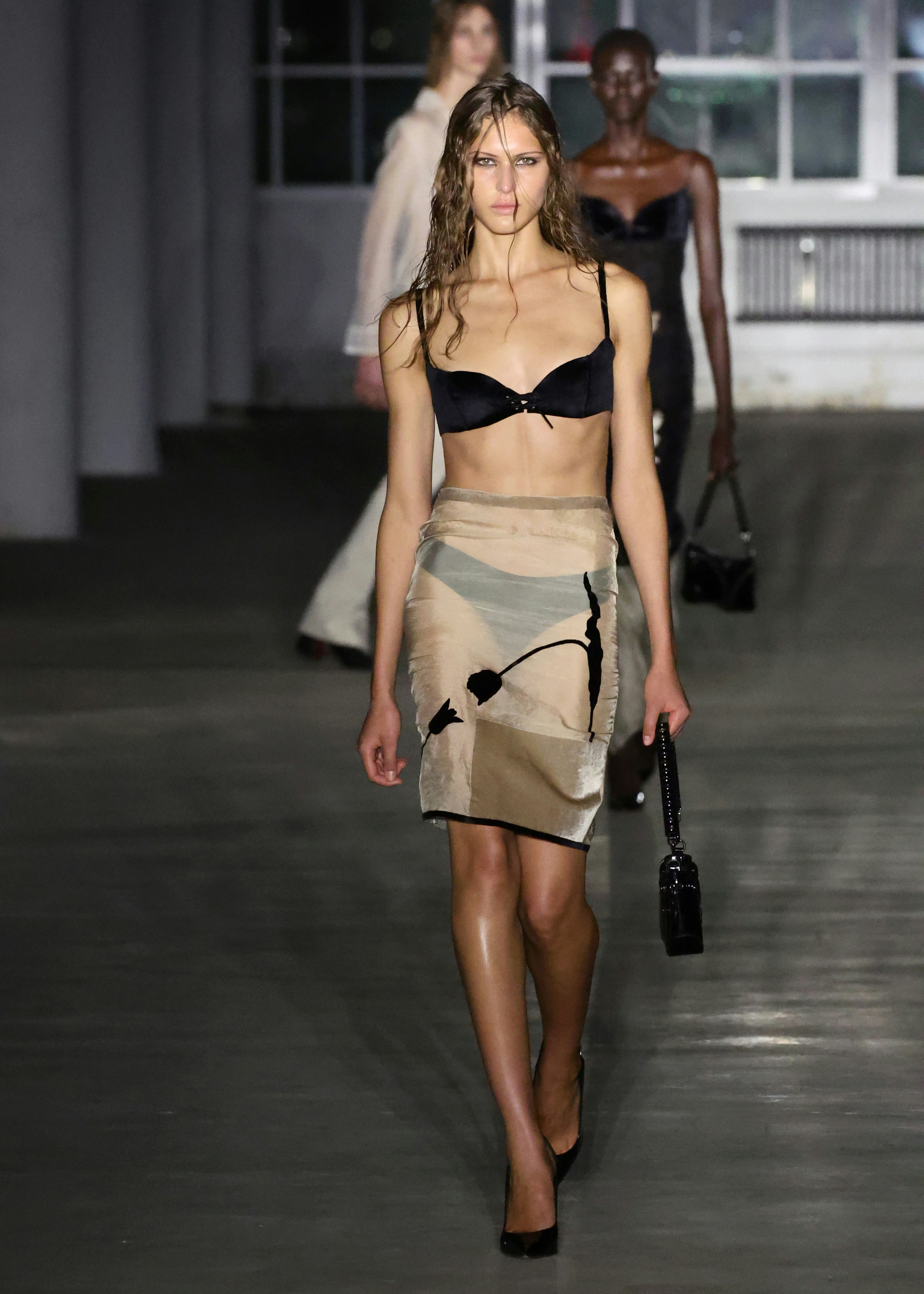 A model walks the runway at the Ludovic De Saint Sernin fashion show.