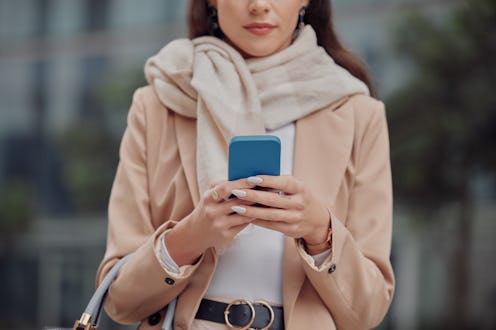 Hands of businesswoman in city with phone, typing for business chat in morning travel to office job....