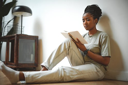 young woman reading a book