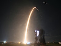 TOPSHOT - A SpaceX Falcon 9 rocket lifts off from launch pad LC-39A at the Kennedy Space Center with...