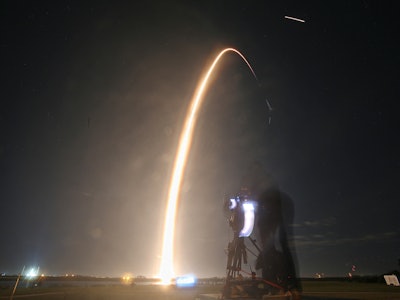 TOPSHOT - A SpaceX Falcon 9 rocket lifts off from launch pad LC-39A at the Kennedy Space Center with...