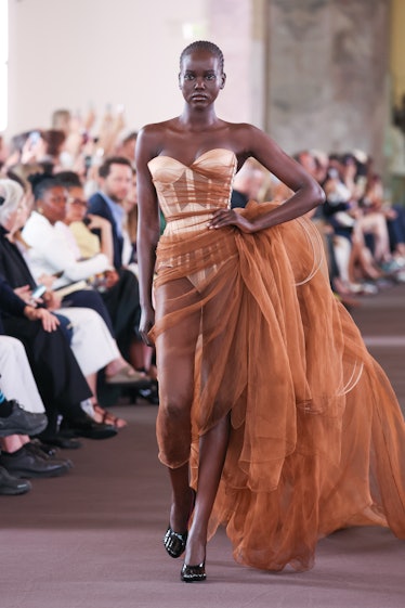 Adut Akech walks the runway during the Schiaparelli Haute Couture Fall/Winter 2023/2024 show as part...