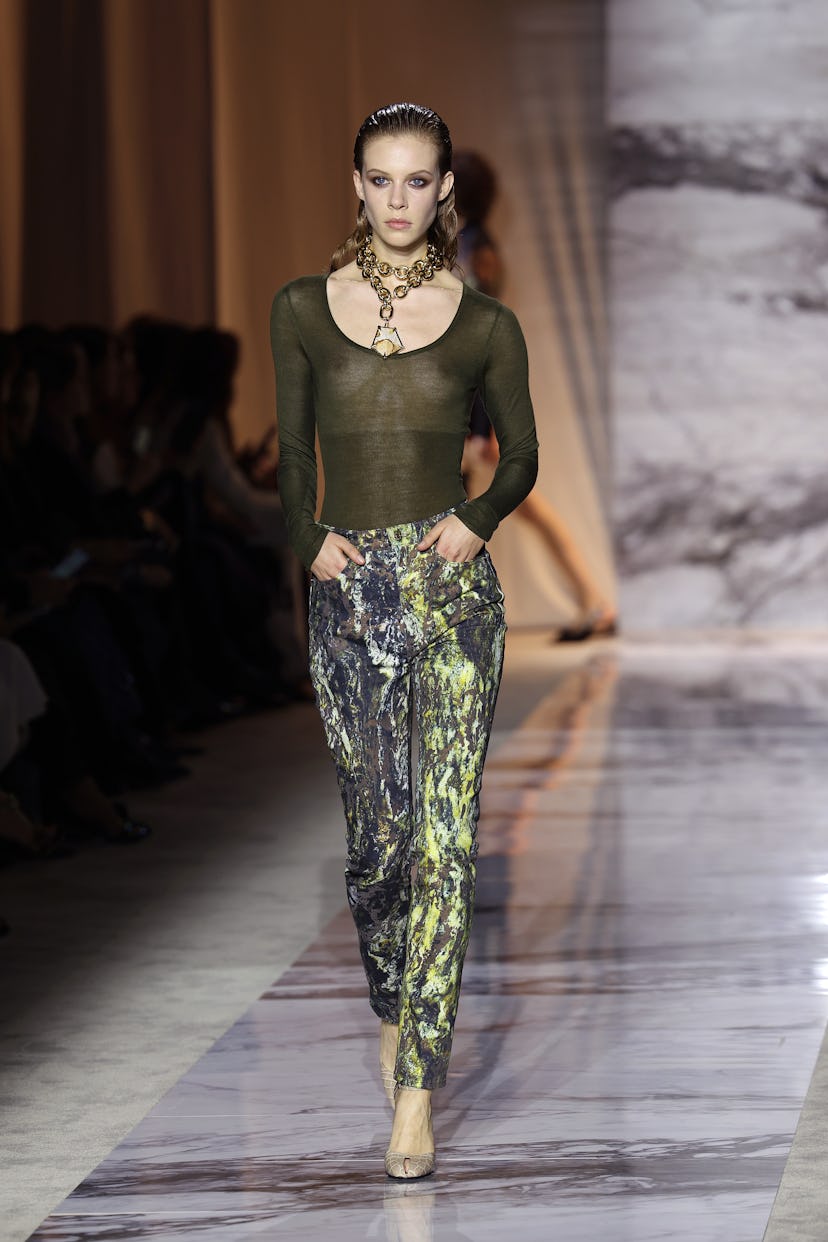 A model walks the runway at the Roberto Cavalli fashion show during Milan Fashion Week.