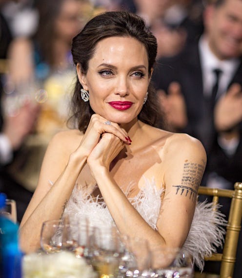 Angelina Jolie red lipstick and tattoos