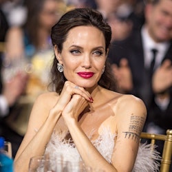 Angelina Jolie red lipstick and tattoos
