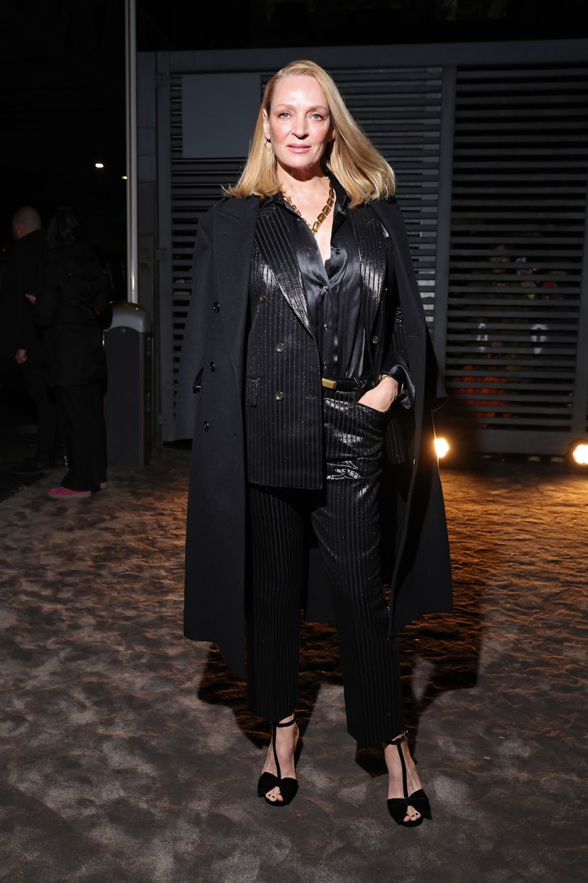 MILAN, ITALY - FEBRUARY 22: Uma Thurman is seen arriving at the Tom Ford fashion show during the Mil...