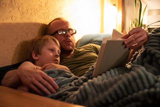 Dad reading his kid a book while the mom was away.