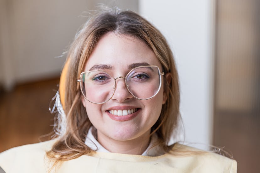 Close-up shot of a broad smile from a female patient after teeth whitening in a modern dental clinic