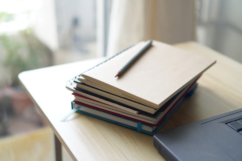 pencil placed on notebook
