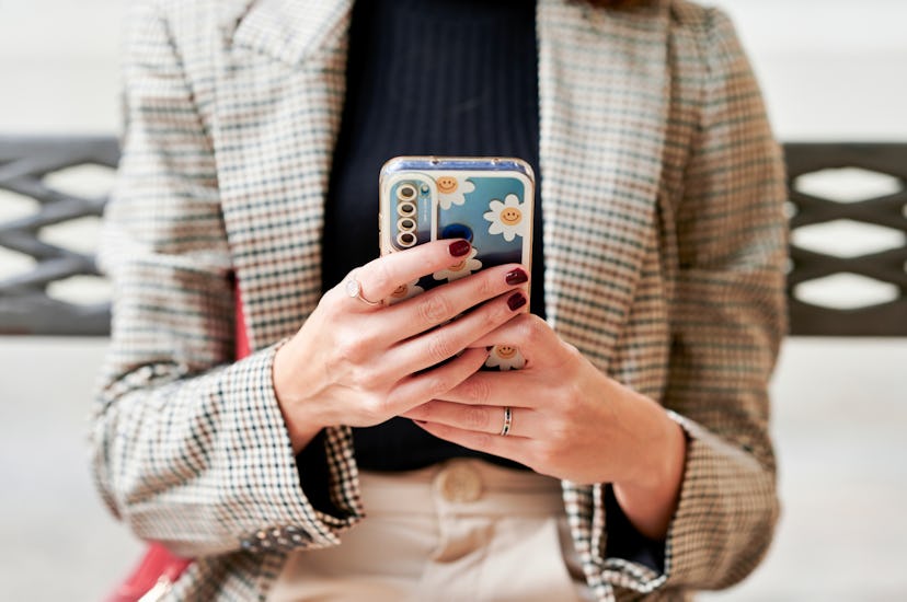 Close-up of woman's hands using mobile phone