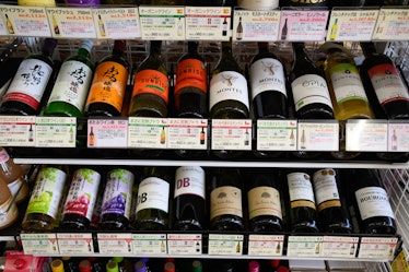 Bottles of wine for sale at a Seven & i Holdings Co.'s SIP store during a media tour in Matsudo, Chi...