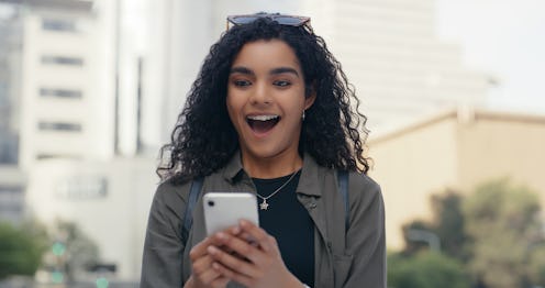 Phone, wow and excited woman in city with reaction to good news, bonus or promotion with text messag...