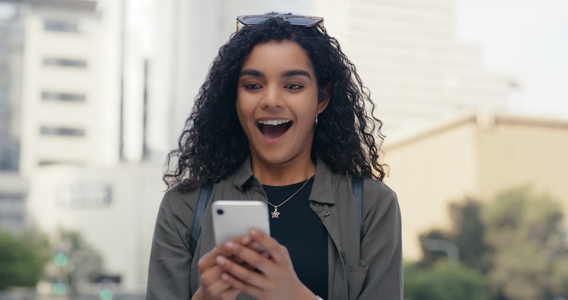 Phone, wow and excited woman in city with reaction to good news, bonus or promotion with text messag...