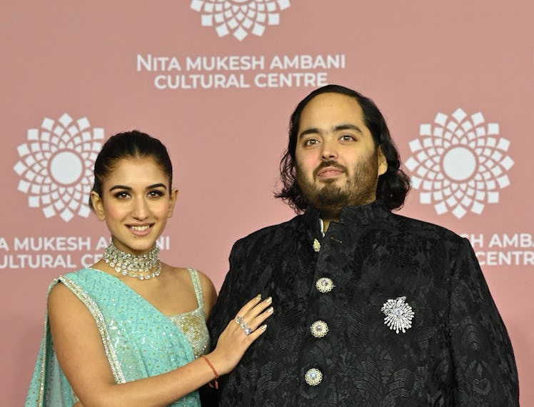 Anant Ambani (R) son of Indian businessman Mukesh Dhirubhai Amani, and his wife Radhika Merchant pos...