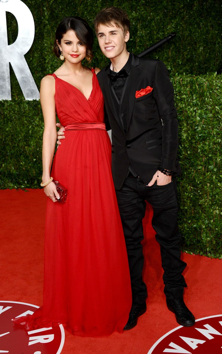 Actress Selena Gomez and musician Justin Bieber arrive at the Vanity Fair Oscar party