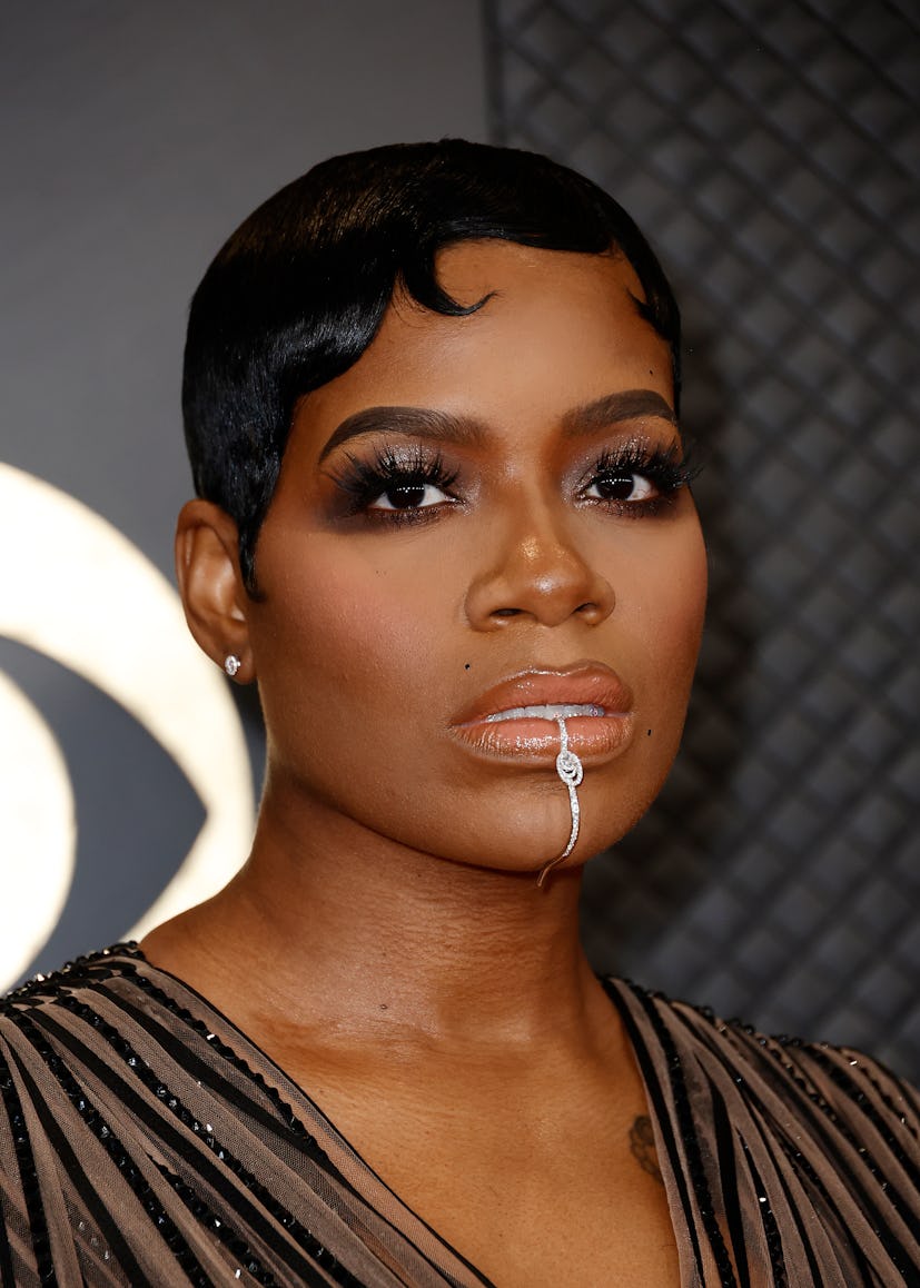 Fantasia Barrino attends the 66th GRAMMY Awards with a dramatic lip piercing.