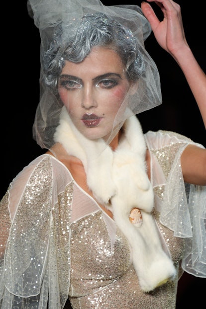 A model on the runway at John Galliano\'s spring 2011 show at Opera Comique. (Photo by Giovanni Gian...