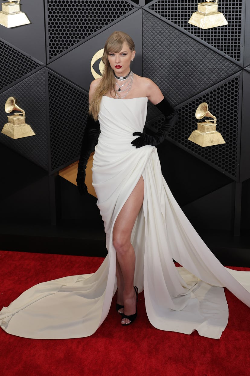 Taylor Swift attends the 2024 GRAMMY Awards in a white corset dress