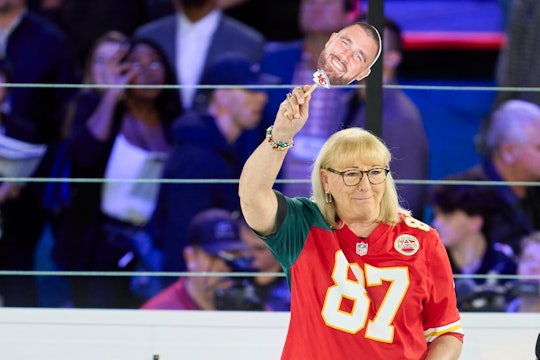 PHOENIX, AZ - FEBRUARY 06: Donna Kelce holds up a photo of her son Travis Kelce #87 of the Kansas Ci...