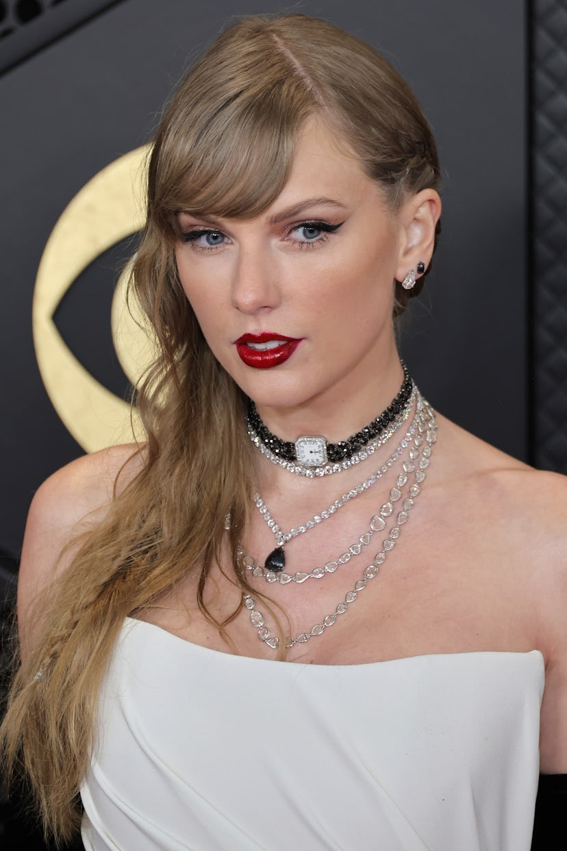 Taylor Swift attends the 66th GRAMMY Awards with side-swept bangs and a braid in her hair.