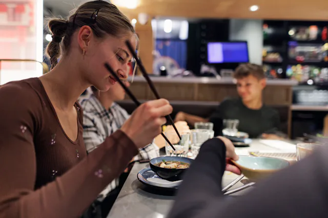 Mom brings her teenagers out to dinner for Valentine's Day instead of romantic partner.
