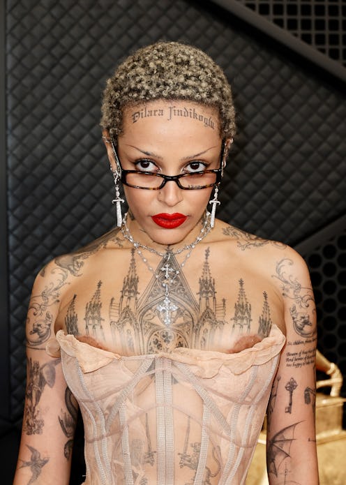 Doja Cat freed the nipple at the 2024 GRAMMY Awards in a sheer bustier naked dress and face tattoos