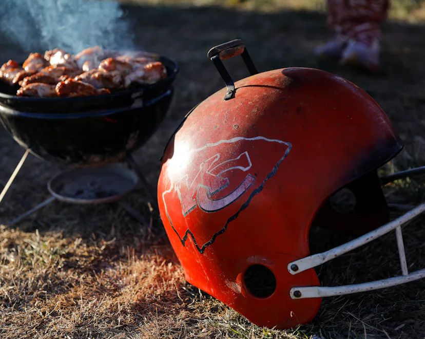 KANSAS CITY, MO - DECEMBER 12: A Kansas City Chiefs barbeque grill cooks chicken in the parking lot ...