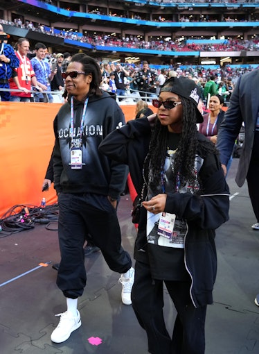 Jay-Z and Blue Ivy Carter attend Super Bowl LVII at State Farm Stadium on February 12, 2023 in Glend...