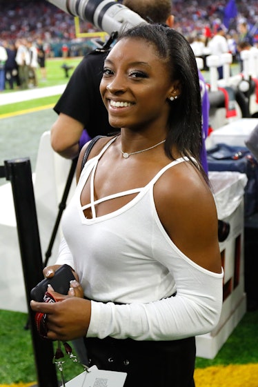 Gymnast Simone Biles watches during Super Bowl 51 between the Atlanta Falcons and the New England P...