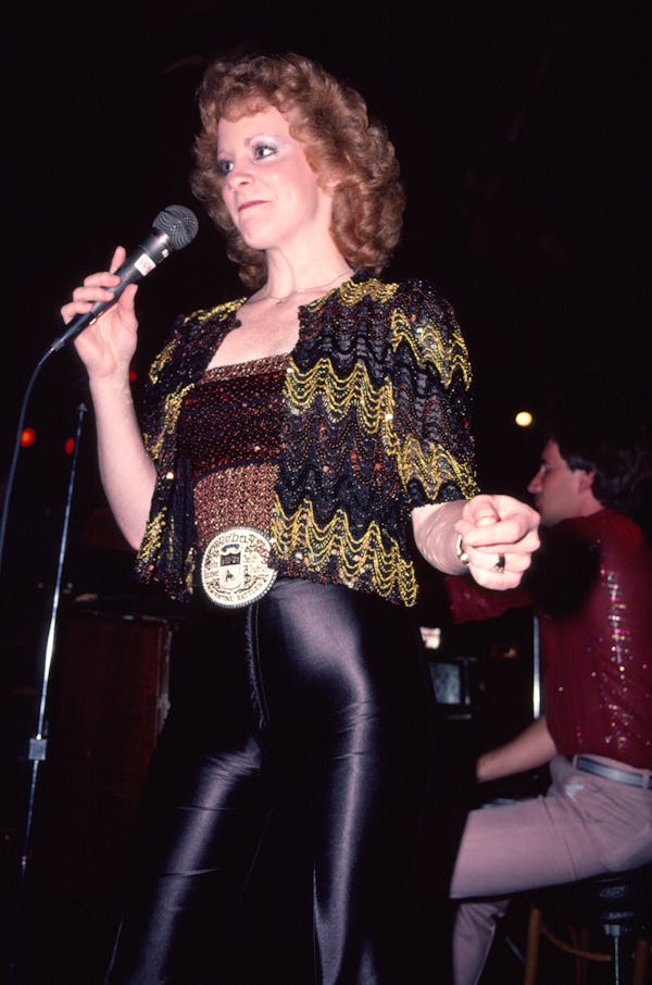 A young Reba McIntire performs in New York in 1982.