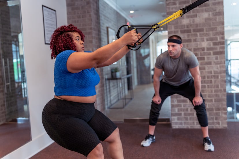 TRX resistance bands play a role in football-inspired workouts.
