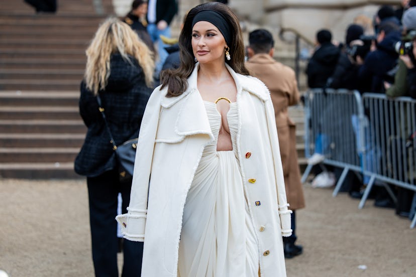 On Jan. 22, Kacey Musgraves wore "Texas hair" at the Schiaparelli Haute Couture Spring / Summer 2024...