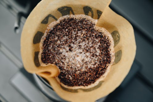 The system is based on the principle of slowly dripping hot water through a layer of ground coffee s...