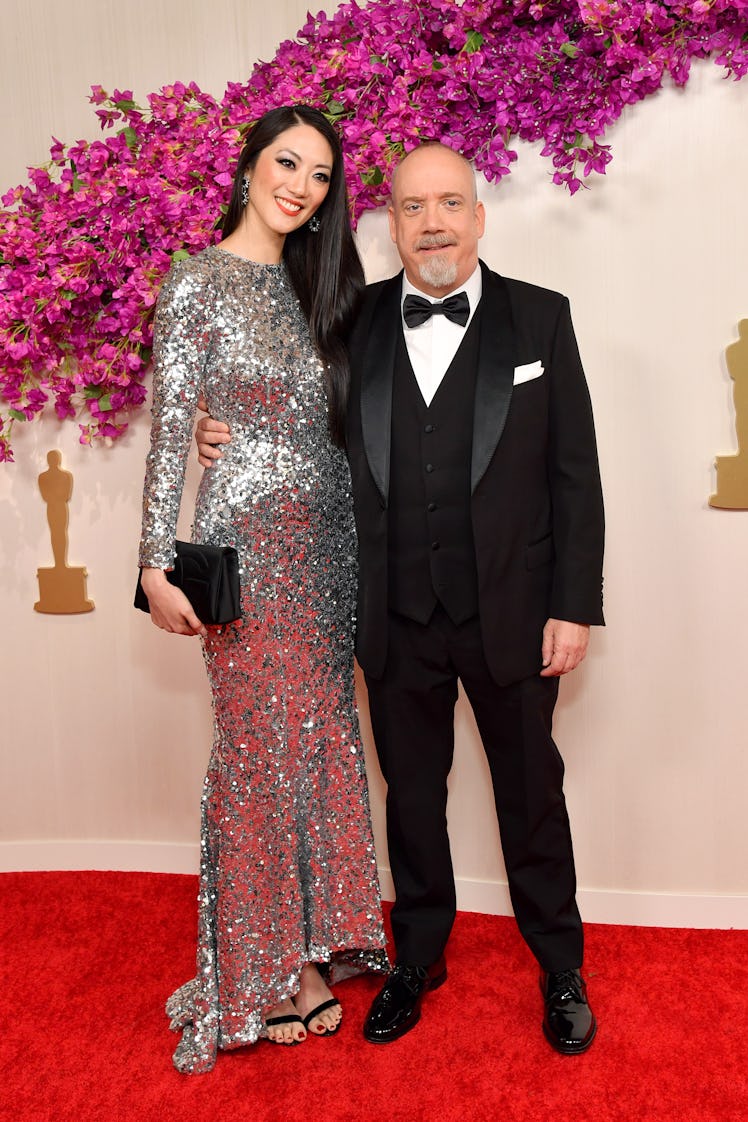 Clara Wong and Paul Giamatti attends the 96th Annual Academy Awards 