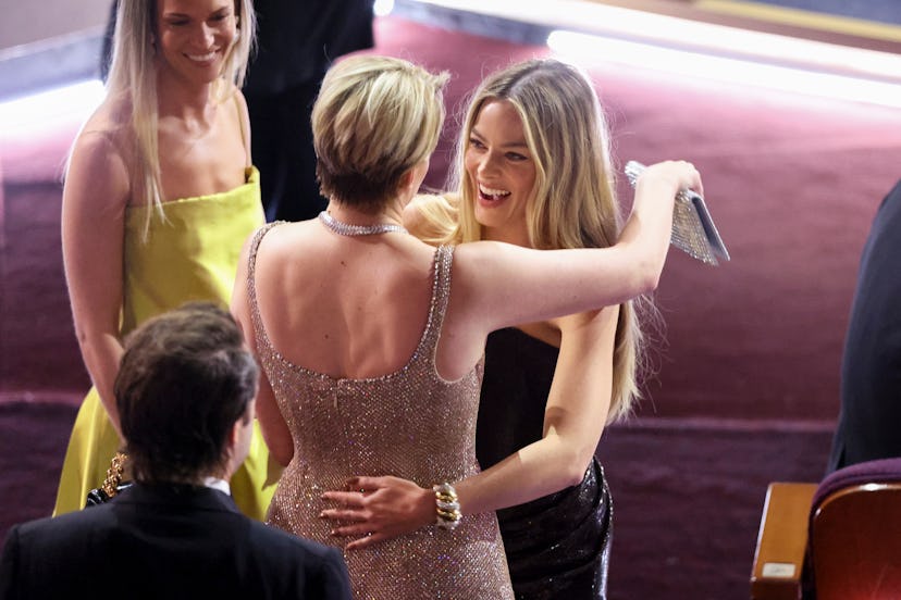 Greta Gerwig and Margot Robbie at the 2024 Oscars. Photo via Getty Images