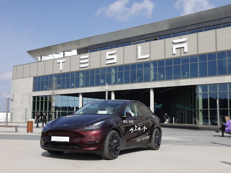 A Tesla Model y car stands in front of the company's plant as Tesla CEO Elon Musk visits the company...