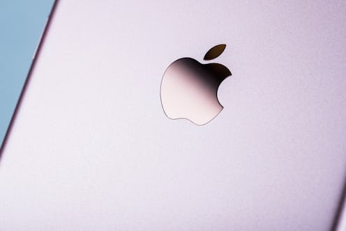Detail of the Apple logo on a 2016 Apple iPhone 7 smartphone with a Rose Gold finish, taken on Septe...