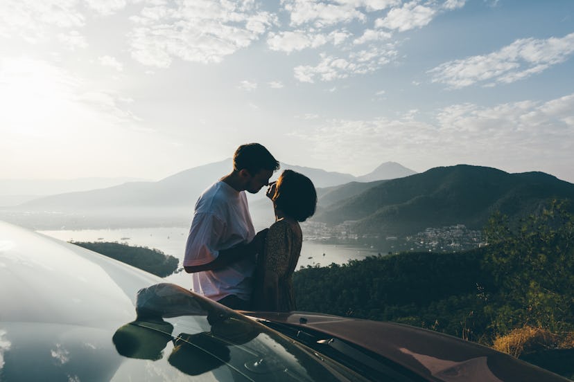 Young couple admiring the view on a road trip.